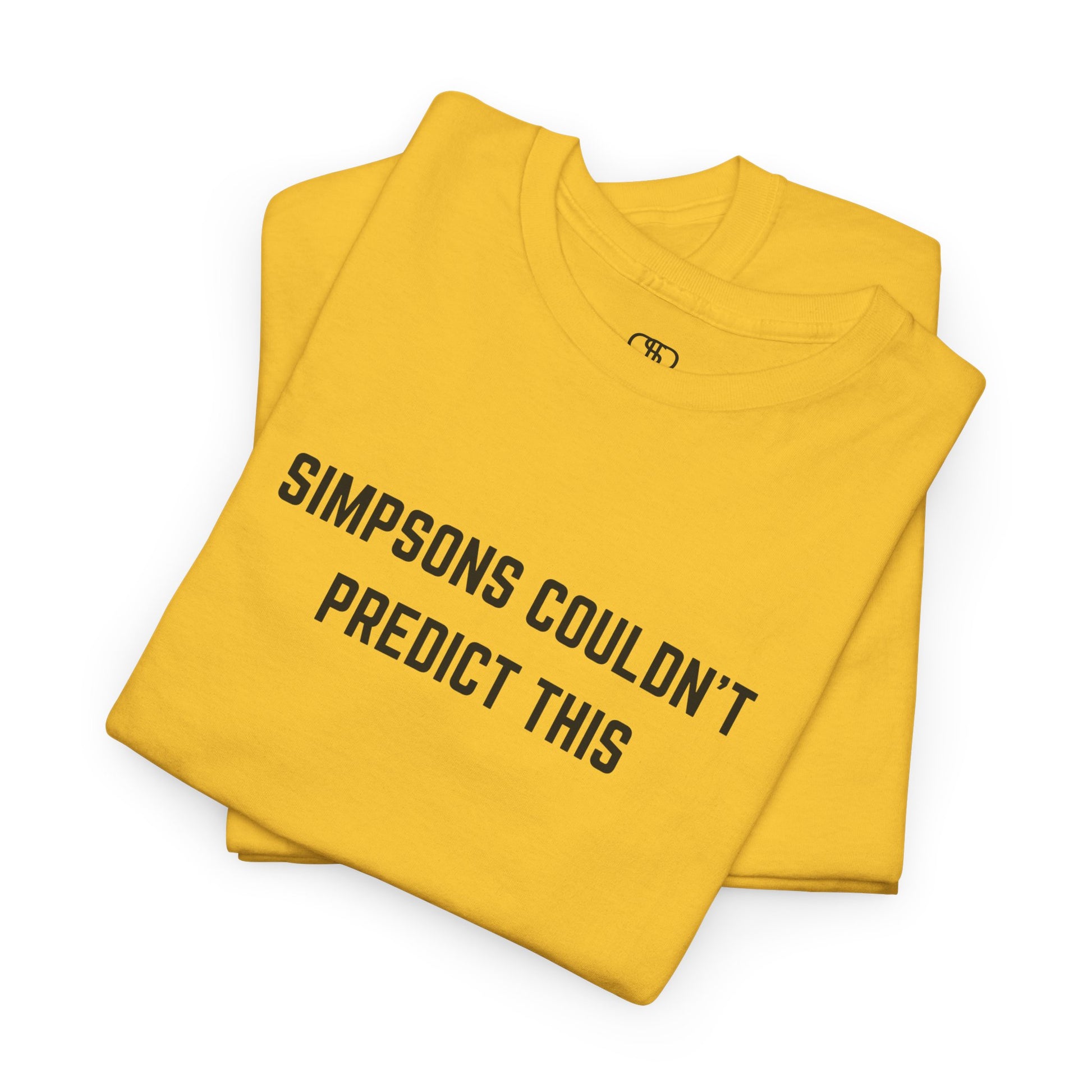 Yellow t-shirt with text 'Simpsons couldn't predict this' on a white background