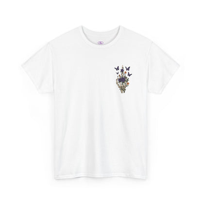 A white t-shirt with a skeleton hand flipping its middle finger on the front surrounded by vines, roses, & butterflies, and a full skeleton design on the back with the phrase “My Last Flying Fuck.”