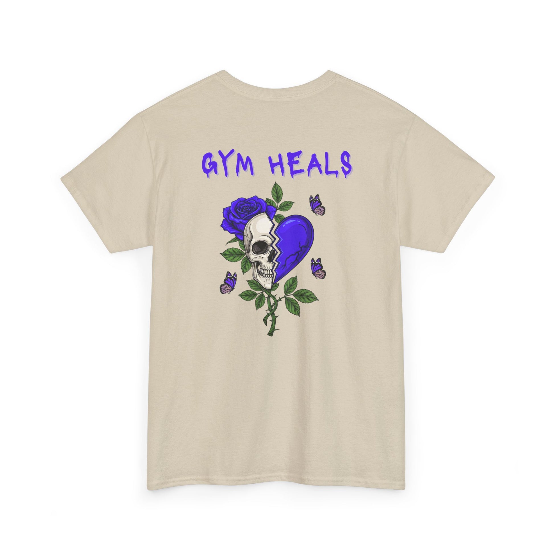 A sand t-shirt with a front design of a half skull, half broken purple heart, and a rose. The back reads "Gym Heals" along with a similar design found on the front.