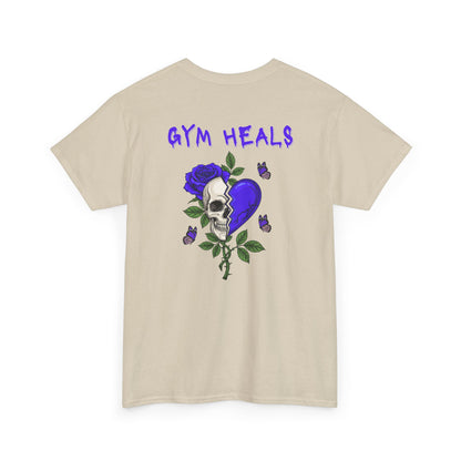 A sand t-shirt with a front design of a half skull, half broken purple heart, and a rose. The back reads "Gym Heals" along with a similar design found on the front.