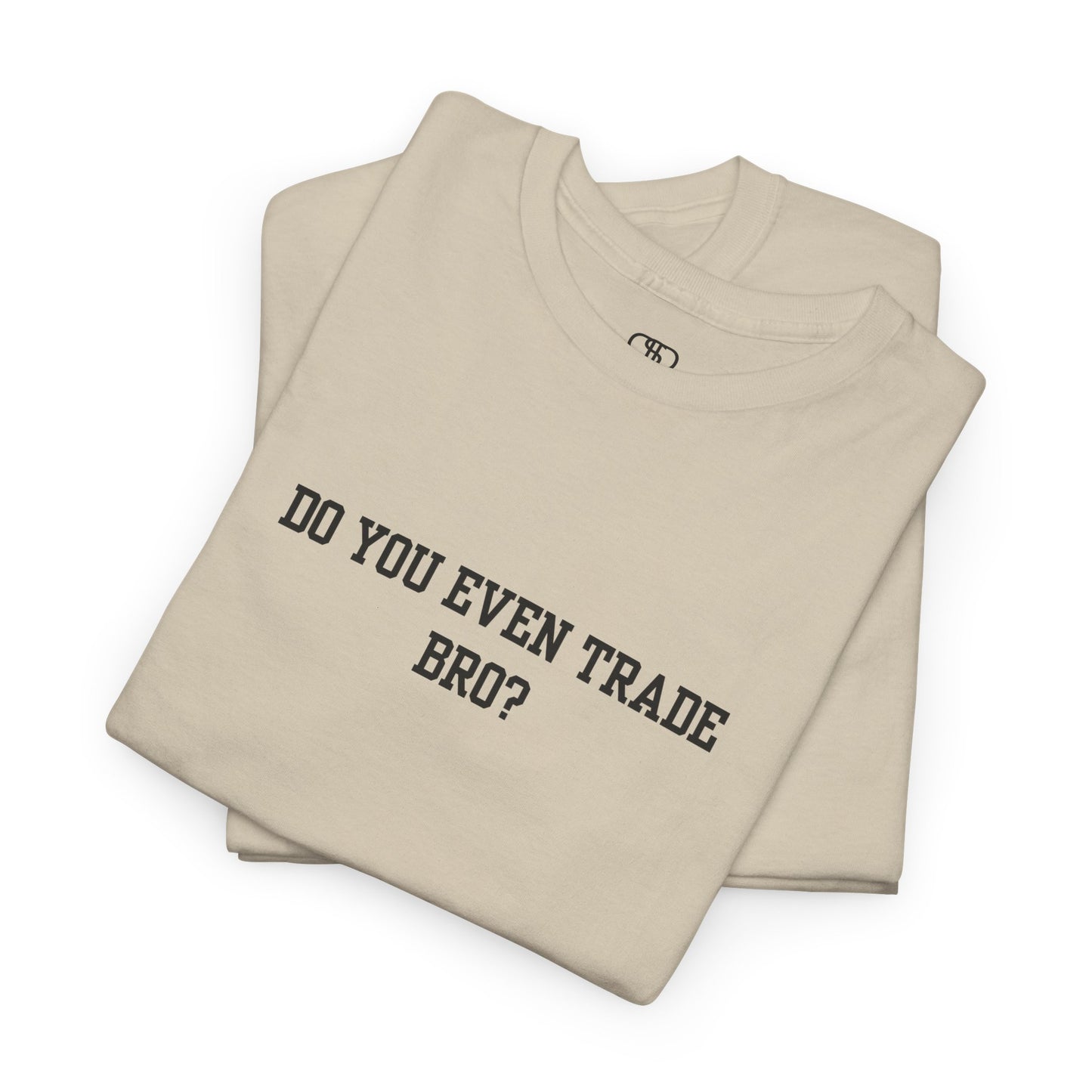 A sand t-shirt with the text "Do You Even Trade, Bro?" prominently displayed on the front. The shirt is shown in a clean, well-lit setting, highlighting the bold and humorous design.
