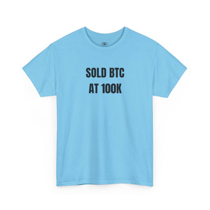 A SKY BLUE T-shirt with bold text "SOLD BTC At 100K" on the front.