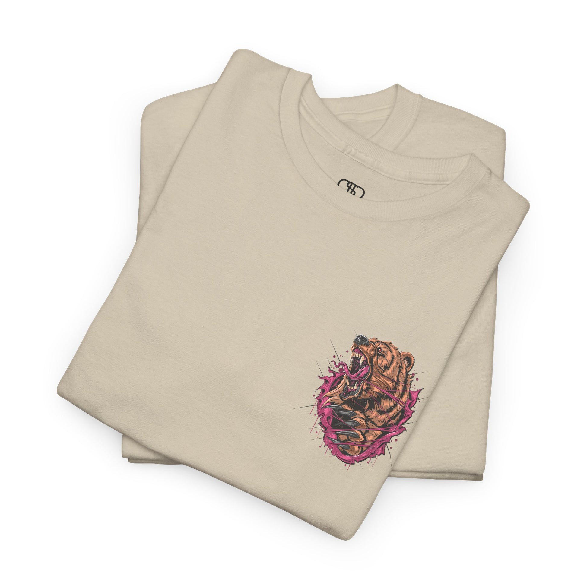 A folded sand T-shirt with a graphic of a raging bear ripping through the fabric, growling, with claws out and red eyes.