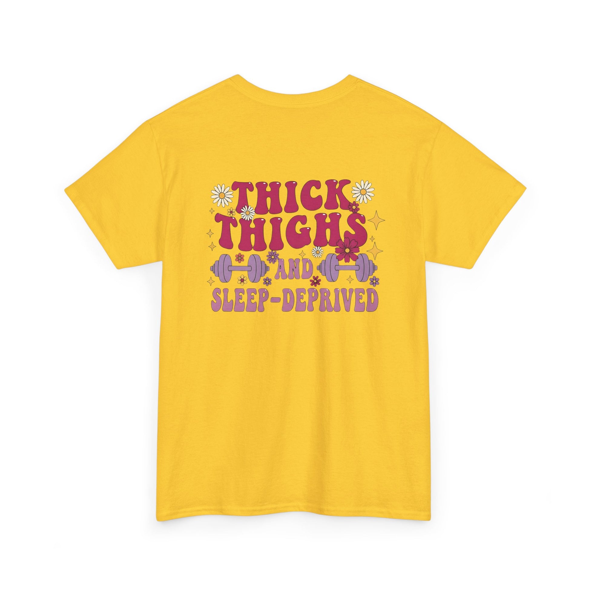 A [daisy] t-shirt with the phrase "Thick Thighs and Sleep Deprived" in a retro font on the front left and enlarged on the back.