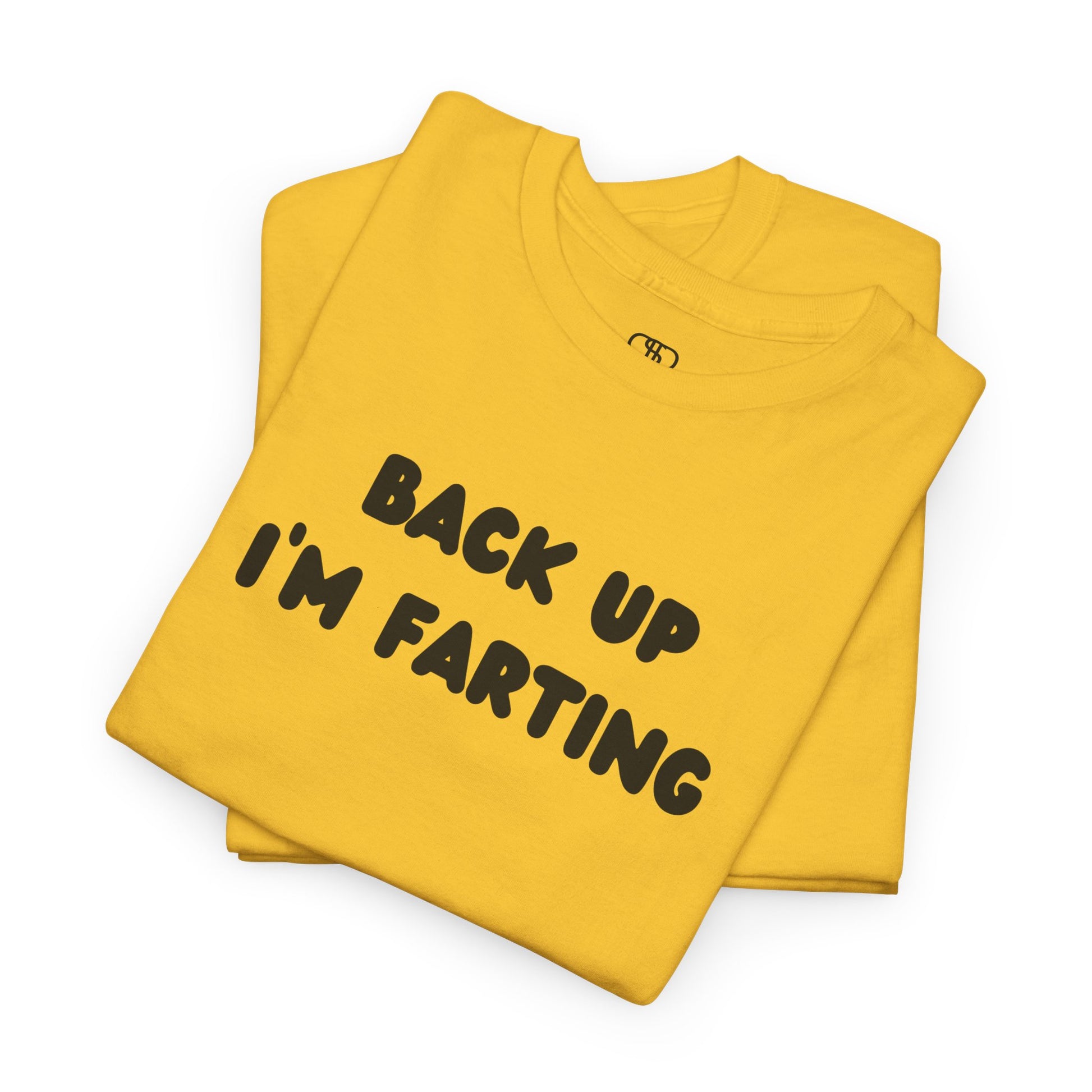 A folded daisy yellow T-shirt with the bold text "Back Up I'm Farting" on the front.