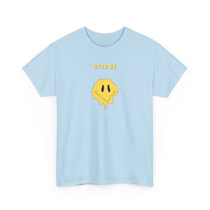 A t-shirt with a graphic of a yellow smiley face emoji melting into a puddle, with the words "Over It" printed below in a bold font.