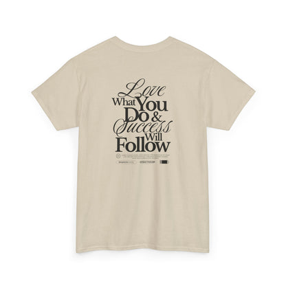 A sand T-shirt featuring a masterclass in motivation. The back features two powerful messages:
A bold declaration: "Love What You Do & Success Will Follow."
A profound reminder: "Every Choice, every Step, weaves the narrative of your life, decide thoughtfully, for each moment shapes your tale's unfolding Journey."