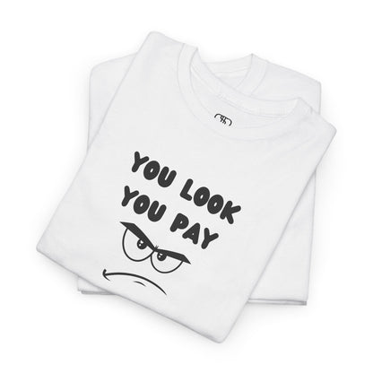 A folded white T-shirt with "You Look You Pay" text and an angry cartoon graphic with scrunched eyebrows.