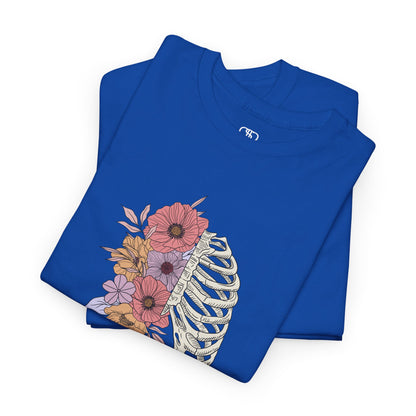 Folded Royal Blue T-shirt with a lung graphic, half skeletal ribcage, half flowers.