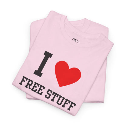 A funny folded light pink t-shirt with the iconic "I Love" design, featuring the text "I," a red heart, and the phrase "Free Stuff" below.