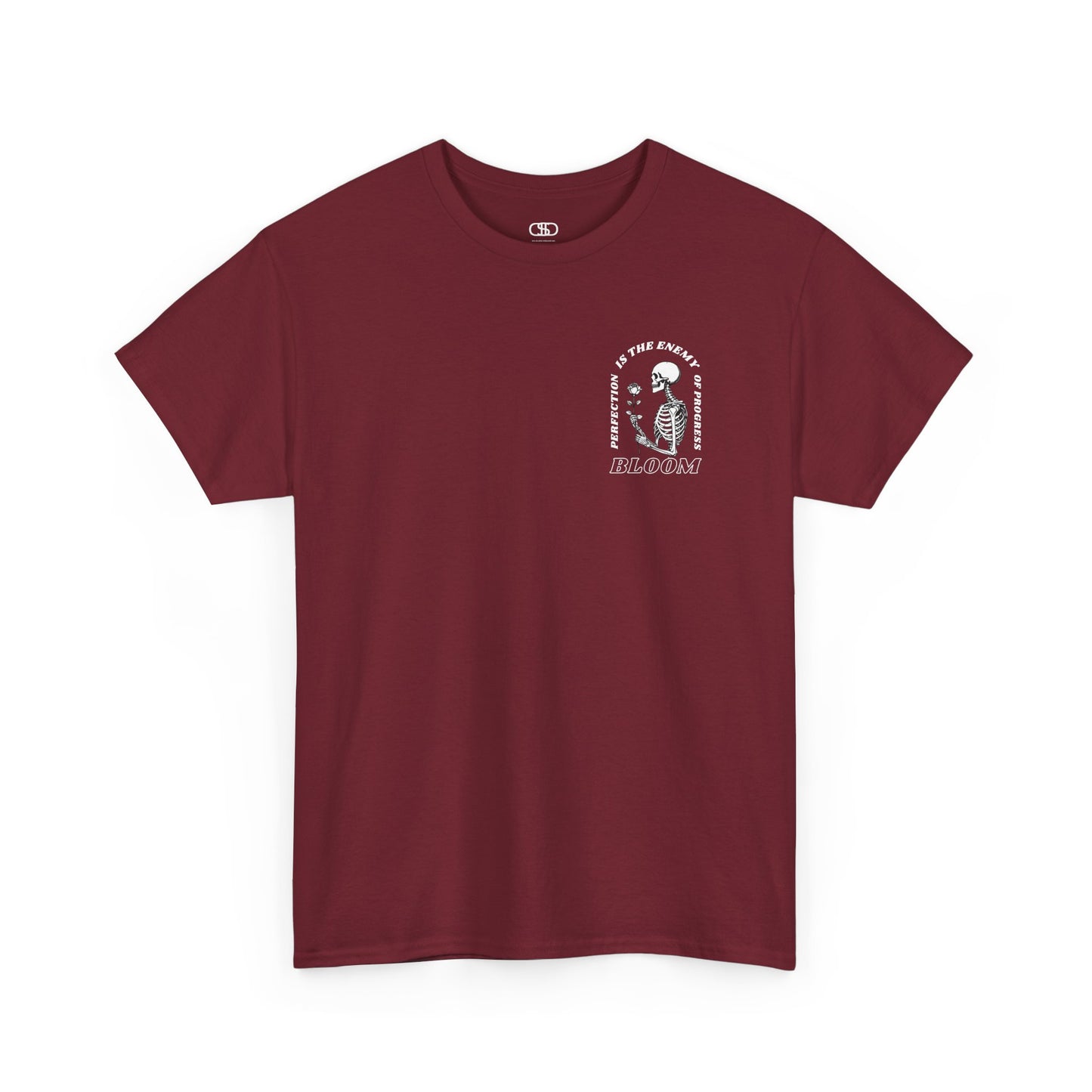 A [red] t-shirt with a central skeleton and rose design and the words “Perfection is the enemy of progress” and “Bloom” on the front.
