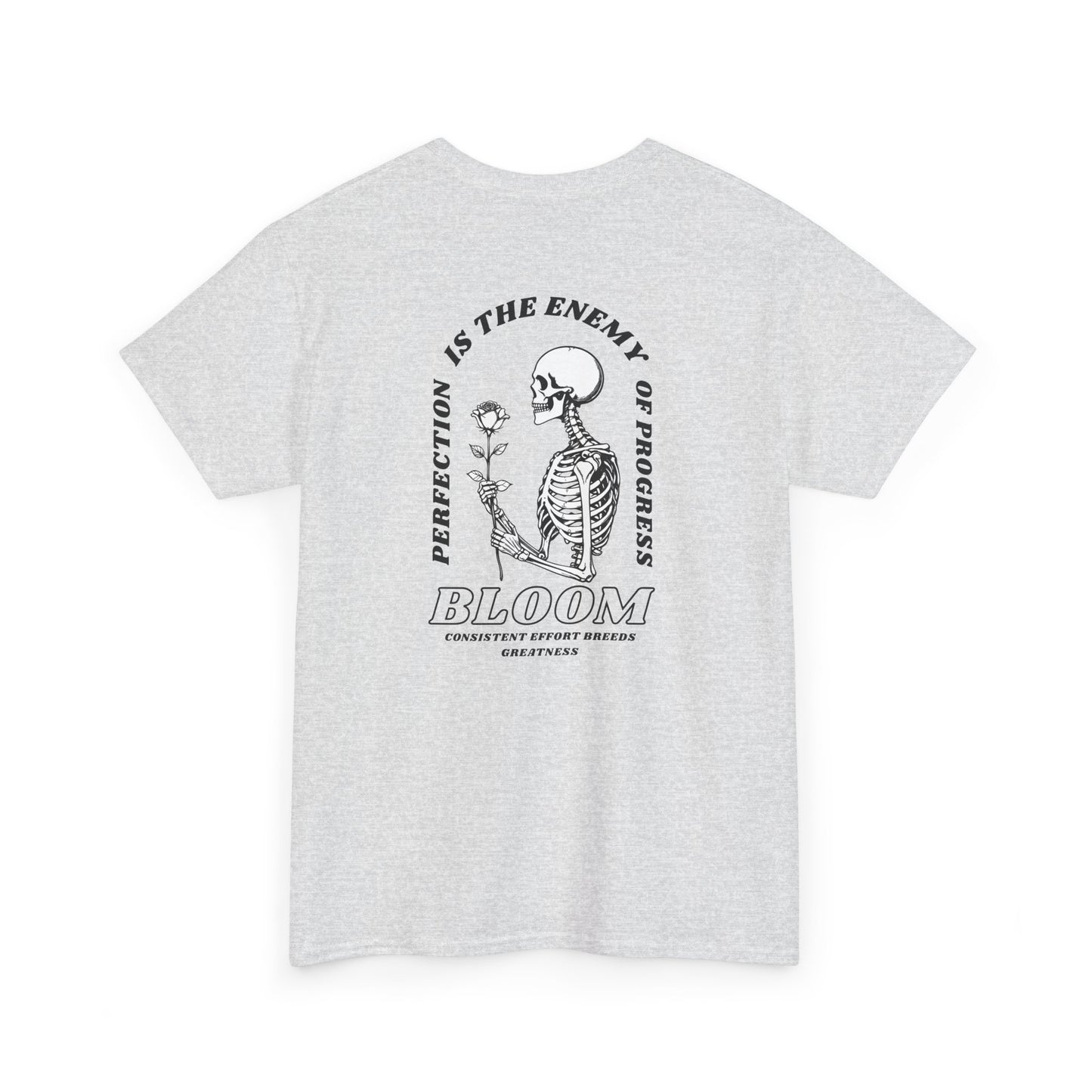 An [Ash gray] t-shirt with a central skeleton and rose design and the words “Perfection is the enemy of progress” and “Bloom” on the front.
