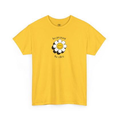 A vibrant yellow sunflower graphic on a yellow t-shirt. The inspirational phrase “Be Present, Be Alive” is elegantly integrated into the design.