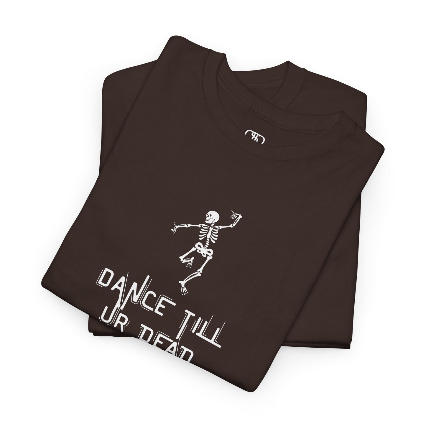 A folded dark brown T-shirt with a dancing skeleton graphic and "Dance Till Ur Dead" text in a creative font.