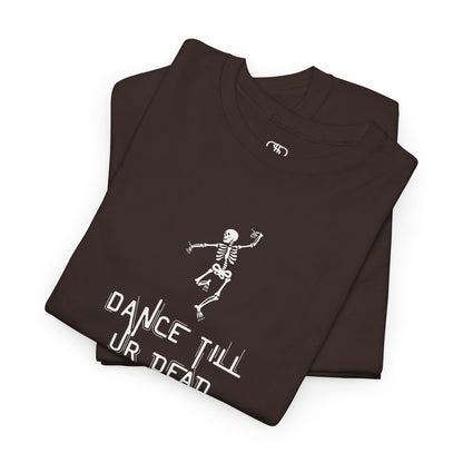 A folded dark brown T-shirt with a dancing skeleton graphic and "Dance Till Ur Dead" text in a creative font.