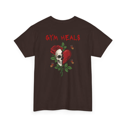 A dark brown t-shirt with a front design of a half skull, half broken heart, and a rose. The back reads "Gym Heals" in red.