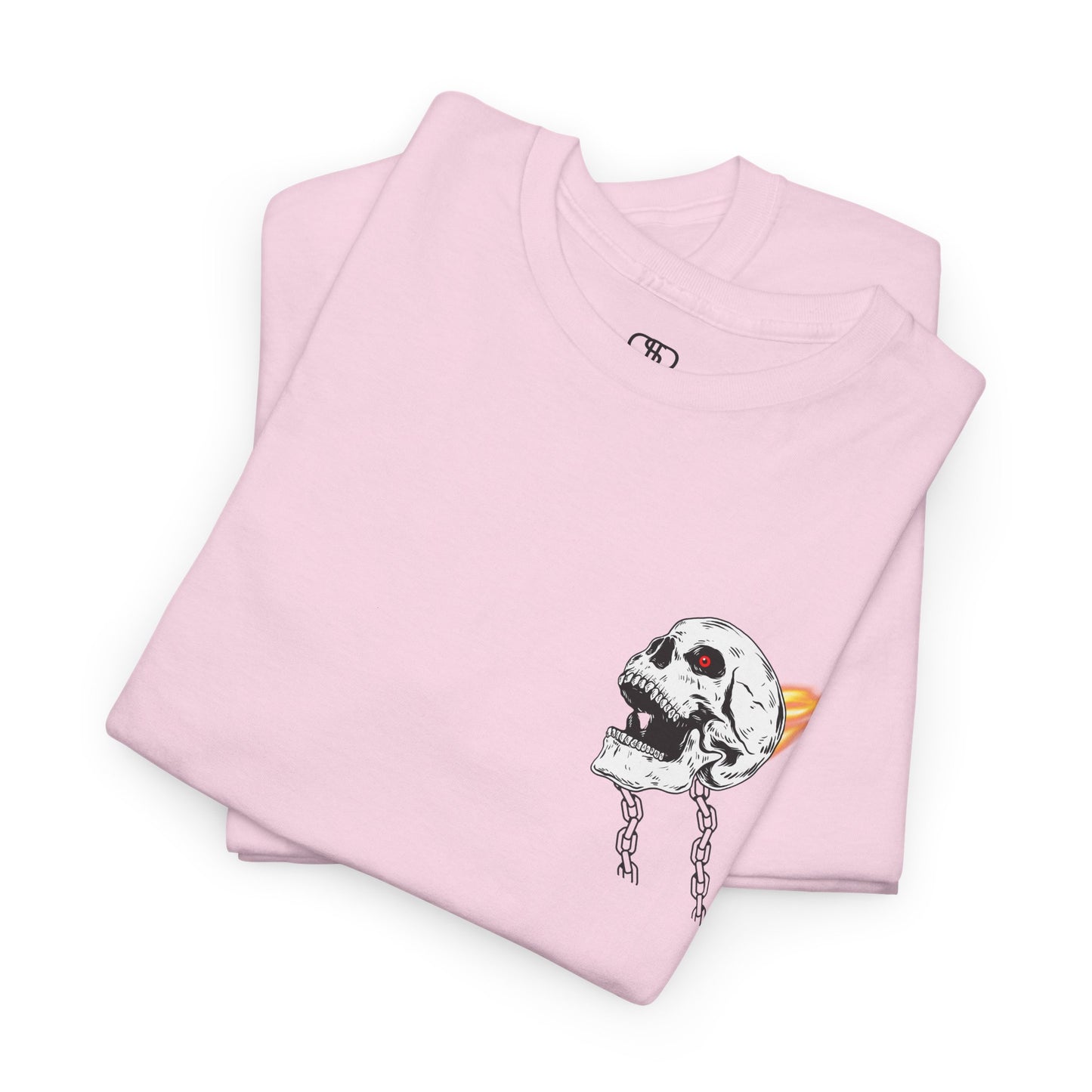 A folded light pink T-shirt with a daring skeleton graphic, red glowing eye, chains forming wings, and a flame background