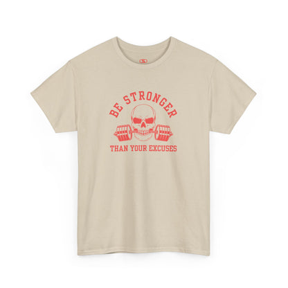 A t-shirt in [sand] with a skull biting a barbell and the words “Be Stronger Than Your Excuses.”