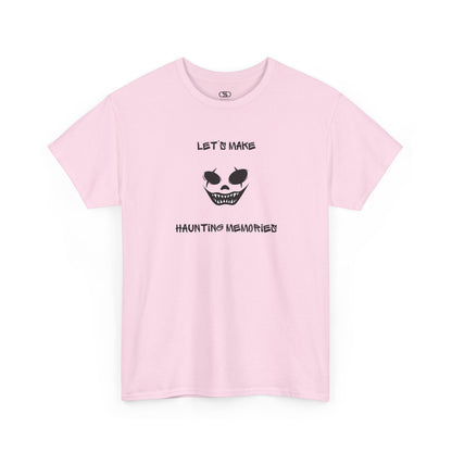 A Light pink T-shirt with a daring clown graphic with sharp teeth and scars, and "Let’s Make Haunting Memories" text.