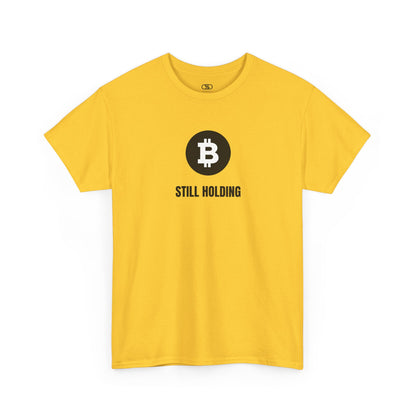 A daisy yellow T-shirt with a Bitcoin emblem and "Still Holding" text in black.
