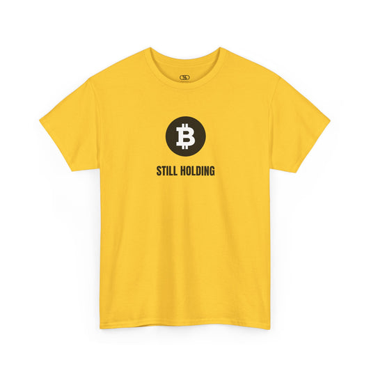 A daisy yellow T-shirt with a Bitcoin emblem and "Still Holding" text in black.