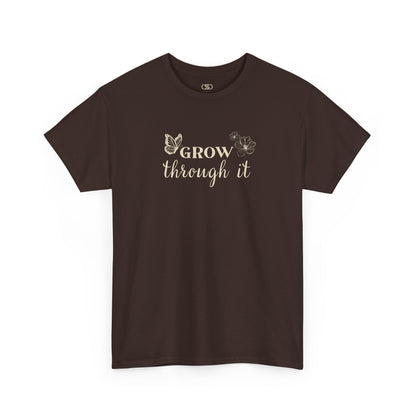 A dark brown t-shirt with "Grow Through It" and a butterfly on the front and a design of a spine with vines, flowers, and butterflies on the back.