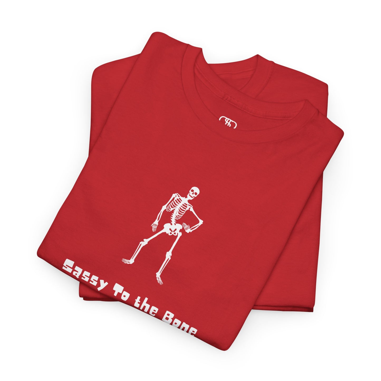 Folded Red T-shirt with a sassy skeleton graphic with hands on hips and "Sassy to the Bone" text in a cartoon font.