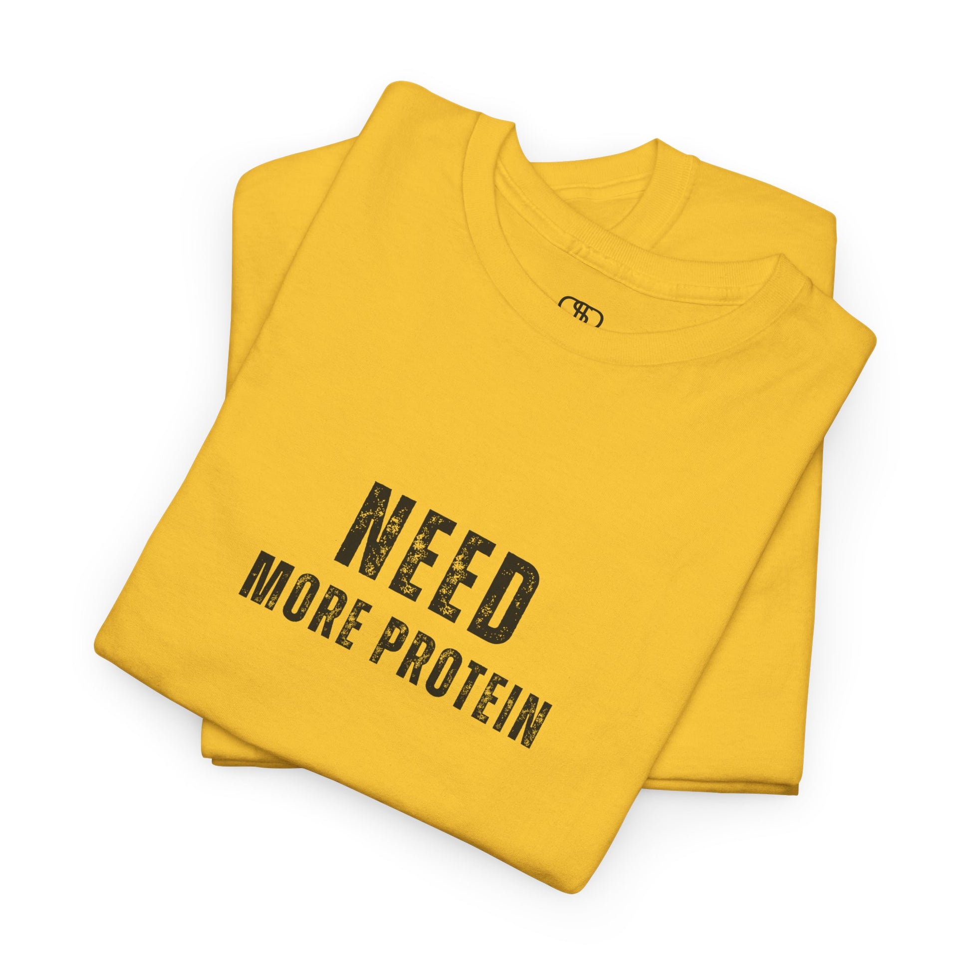A folded daisy t-shirt with the words “Need Protein” in a large grunge font.