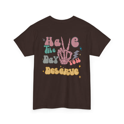 A [dark brown] t-shirt with a skeletal peace sign on the front and the phrase “Have the day you deserve” with a large skeletal peace sign on the back.