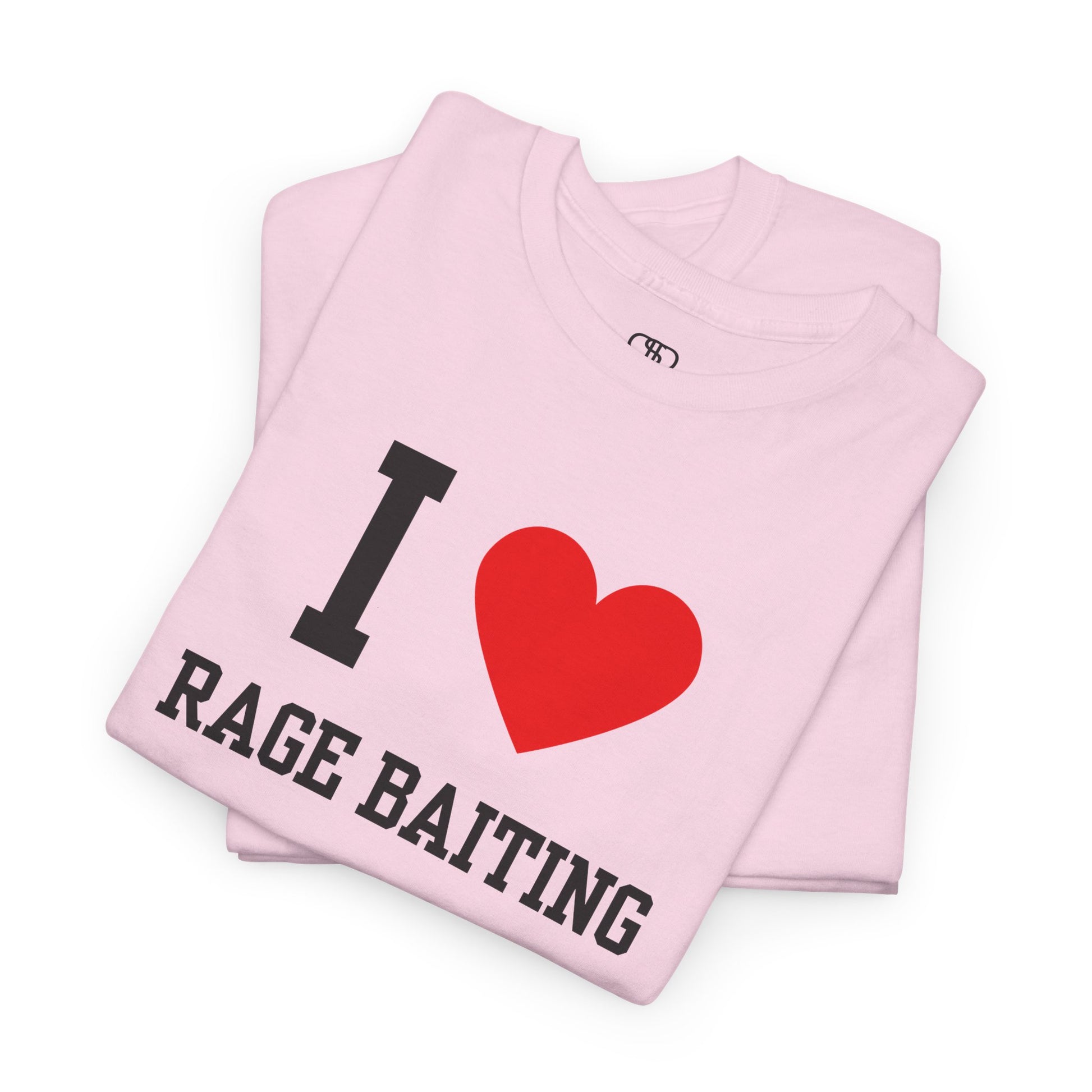 A folded light pink t-shirt featuring the classic "I Love" graphic style with the text "I," a red heart, and the words "Rage Baiting" below it.