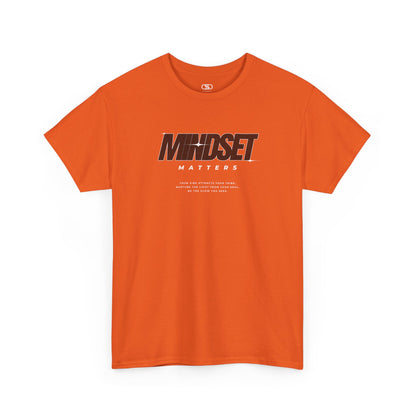 An orange T-shirt featuring text stating "Mindset Matters" text with stars on a t-shirt, inspirational quote below.
