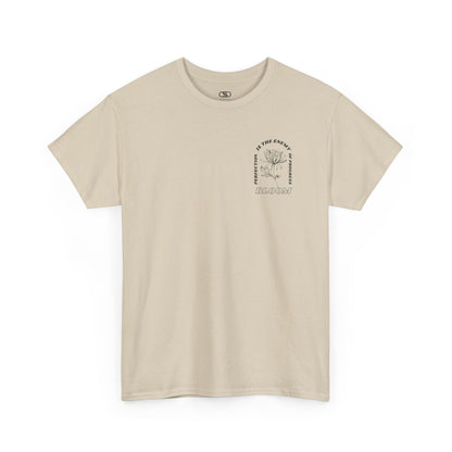 A [sand] t-shirt with a central flower design and the words “Perfection is the enemy of progress” and “Bloom” underneath it the phrase "Consistent effort breeds greatness." 