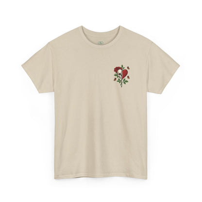 A beige t-shirt with a front design of a half skull, half broken heart, and a rose. The back reads "Gym Heals" in red.