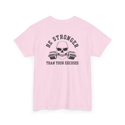 A t-shirt in [light pink color] with a skull biting a barbell and the words “Be Stronger Than Your Excuses.”