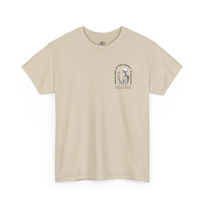 A [sand] t-shirt with a central skeleton and rose design and the words “Perfection is the enemy of progress” and “Bloom” on the front.