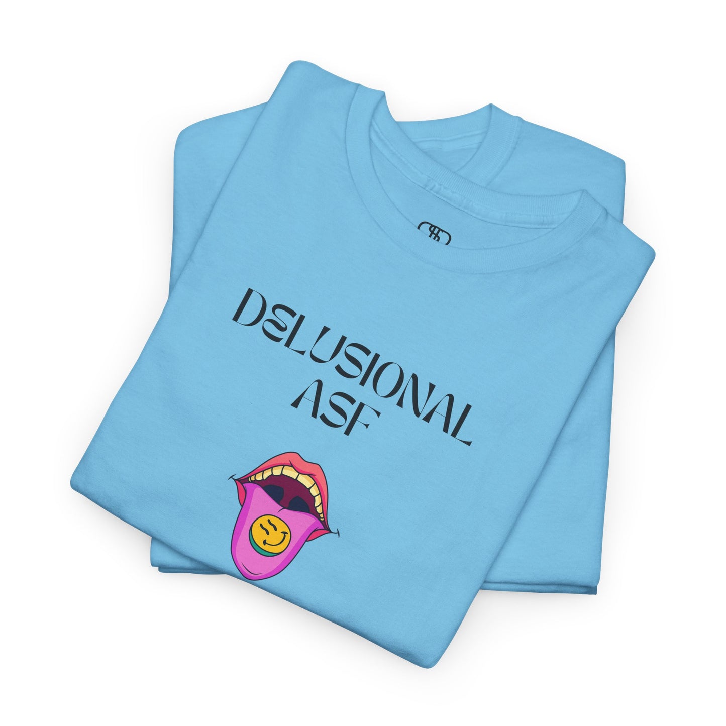 A folded sky blue T-shirt with "Delusional asf" text, an open mouth graphic with tongue out, and a happy face emoji pill.