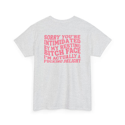An Ash gray t-shirt with a skeletal hand in a bubble on the front and the phrase “Sorry you’re intimidated by my resting Bitch ace I’m actually a fucking delight” on the back.