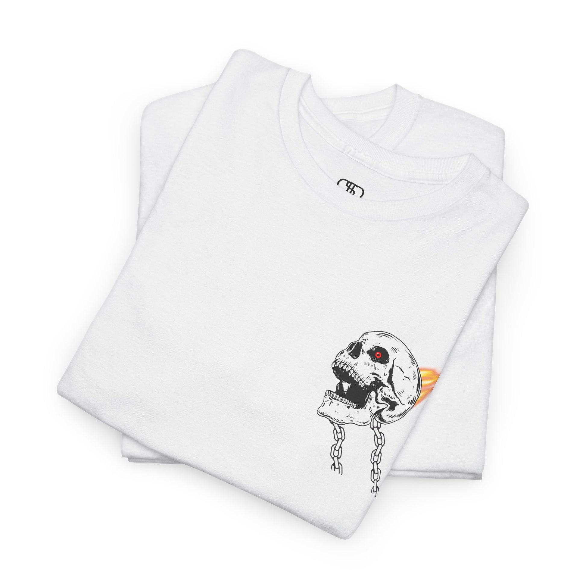 A folded white T-shirt with a daring skeleton graphic, red glowing eye, chains forming wings, and a flame background