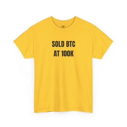 A daisy yellow T-shirt with bold text "SOLD BTC At 100K" on the front.