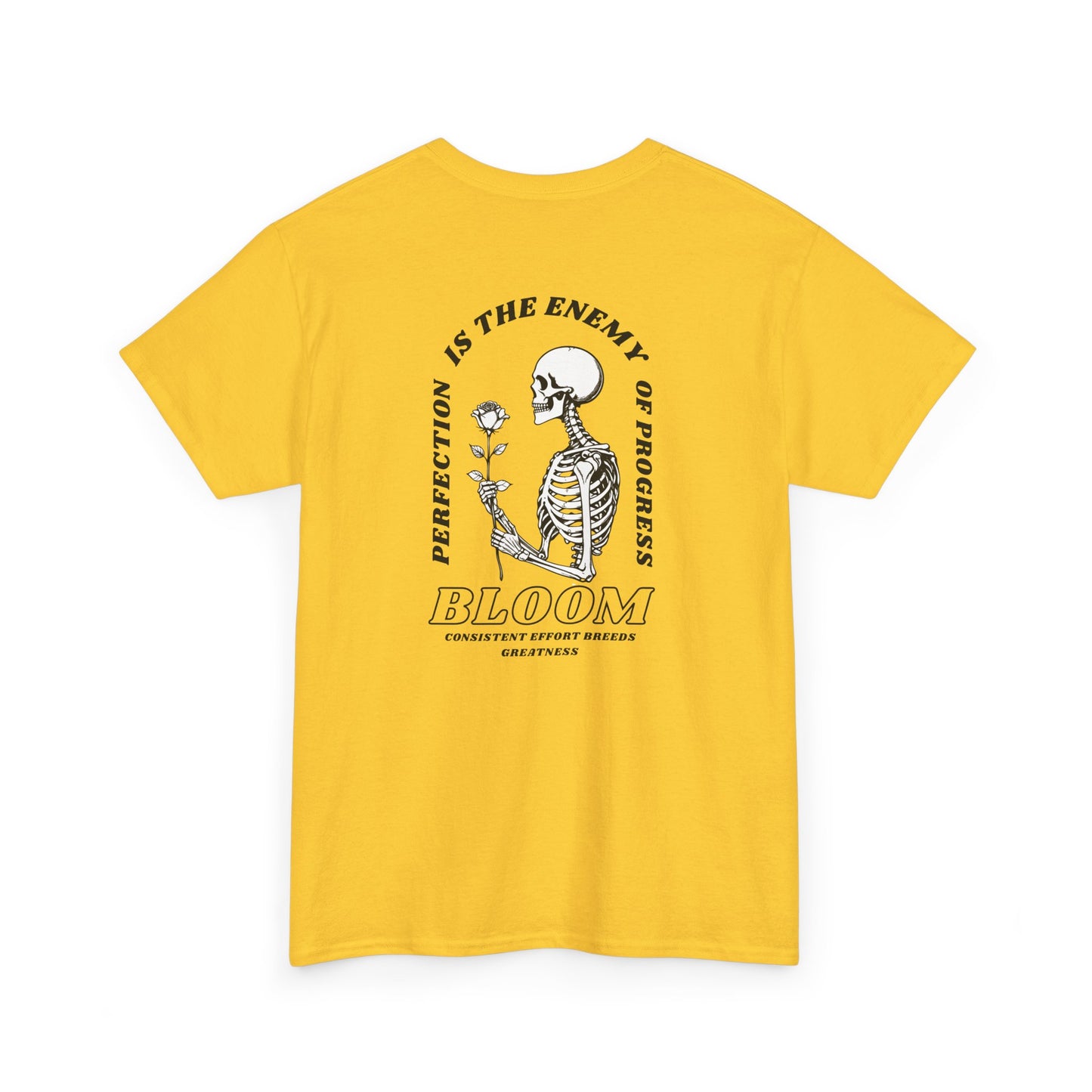 A [daisy] t-shirt with a central skeleton and rose design and the words “Perfection is the enemy of progress” and “Bloom” on the front.