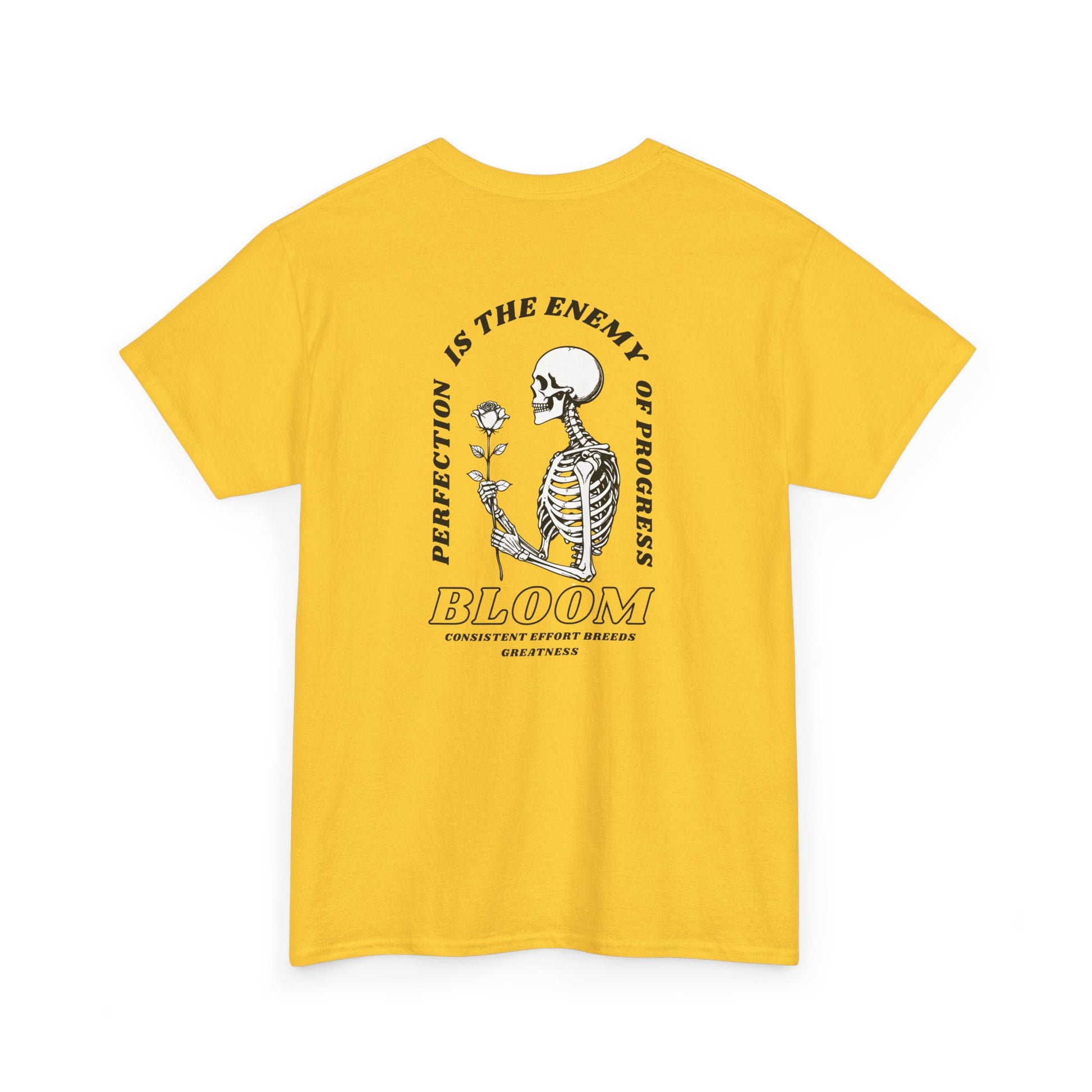 A [daisy] t-shirt with a central skeleton and rose design and the words “Perfection is the enemy of progress” and “Bloom” on the front.