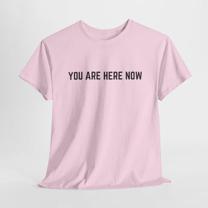 Front of a t-shirt with the grounding phrase "You are Here now" in a clean, minimalist font.