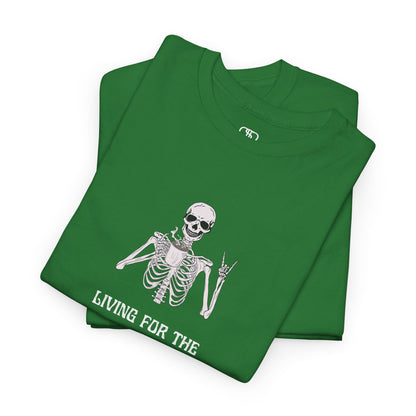 A folded turf green T-shirt with a skeleton holding a hot coffee, displaying a rock hand symbol, and "Living For The Coffee" text.