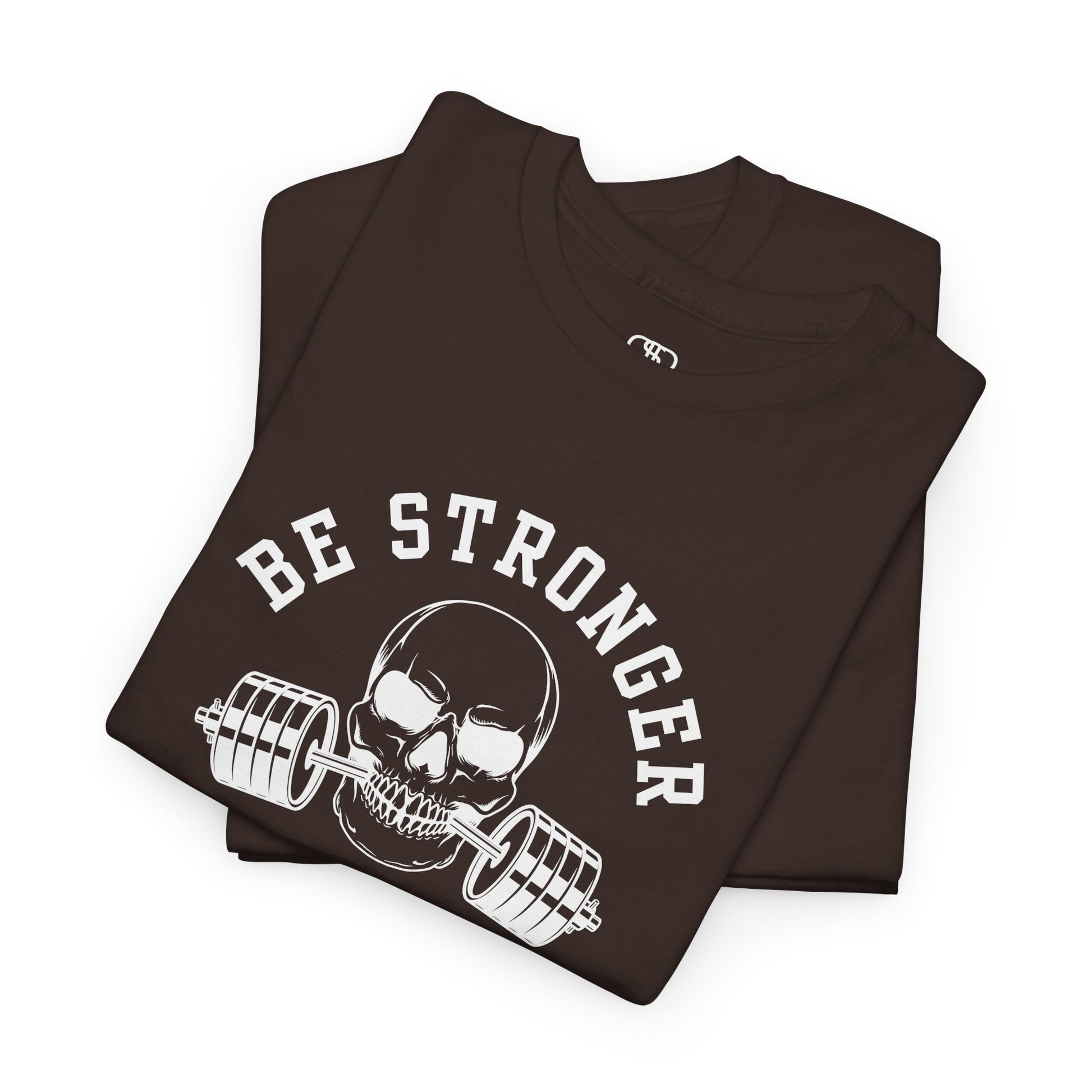  A folded t-shirt in [dark brown] with a skull biting a barbell and the words “Be Stronger Than Your Excuses.”