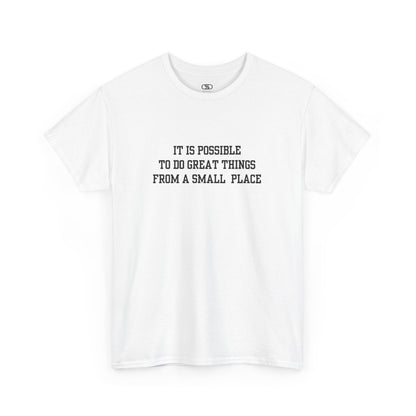A white t-shirt with the quote “It is possible to do great things from a small place” on the front.
