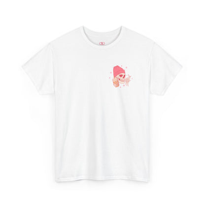 A WHITE T-shirt with a skeleton in a pink beanie holding a frozen coffee, snapping fingers, surrounded by sparkles graphic.