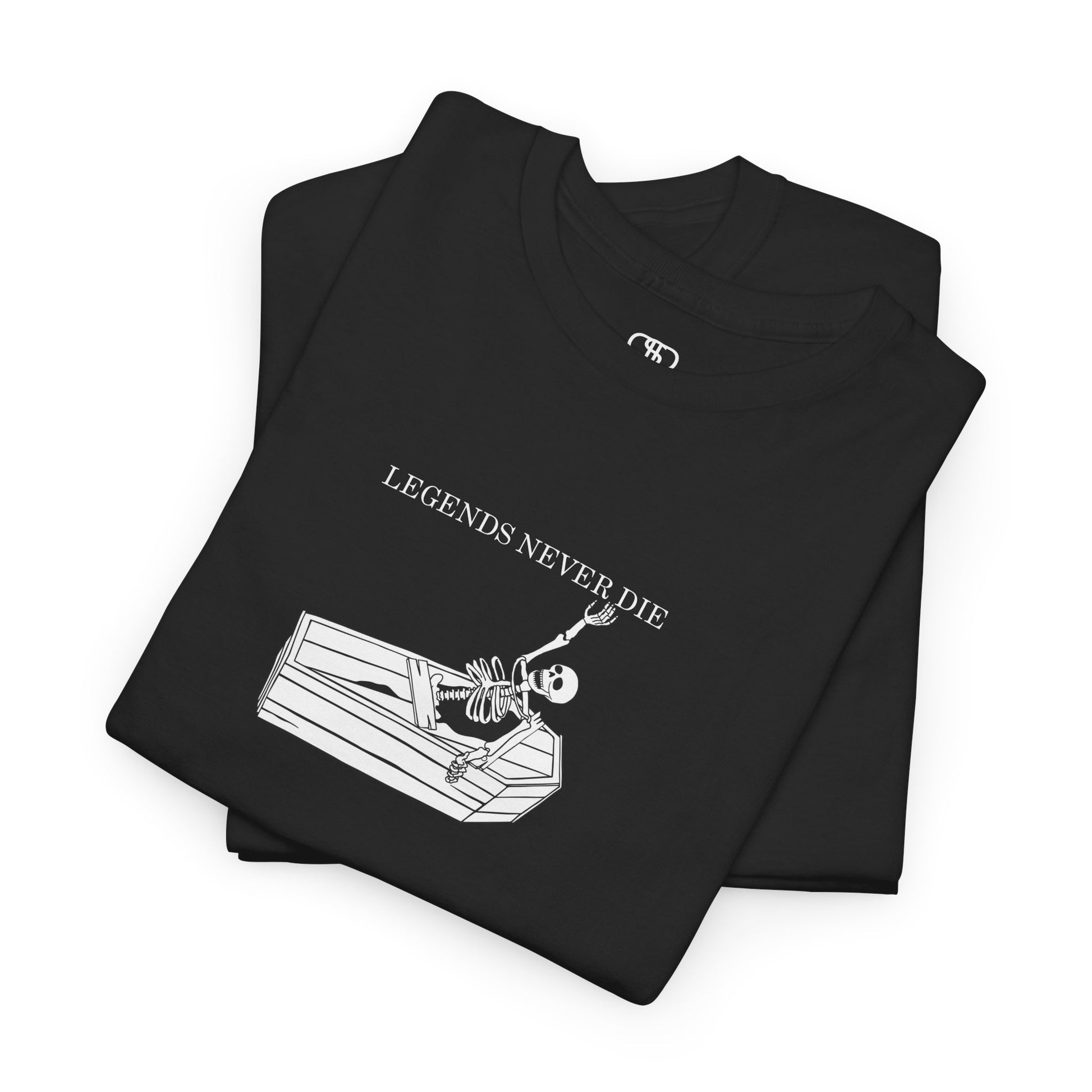 A folded black T-shirt with a skeleton breaking free from a casket, reaching up towards "Legends Never Die" text.
