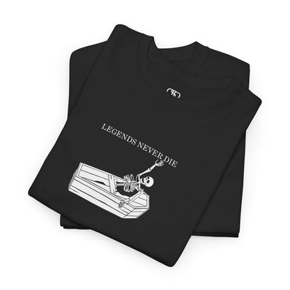 A folded black T-shirt with a skeleton breaking free from a casket, reaching up towards "Legends Never Die" text.
