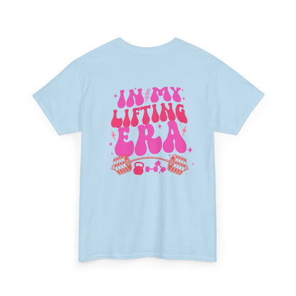 A light blue t-shirt with a retro smiley face on the front and the phrase “In my lifting Era” in a creative retro design on the back.