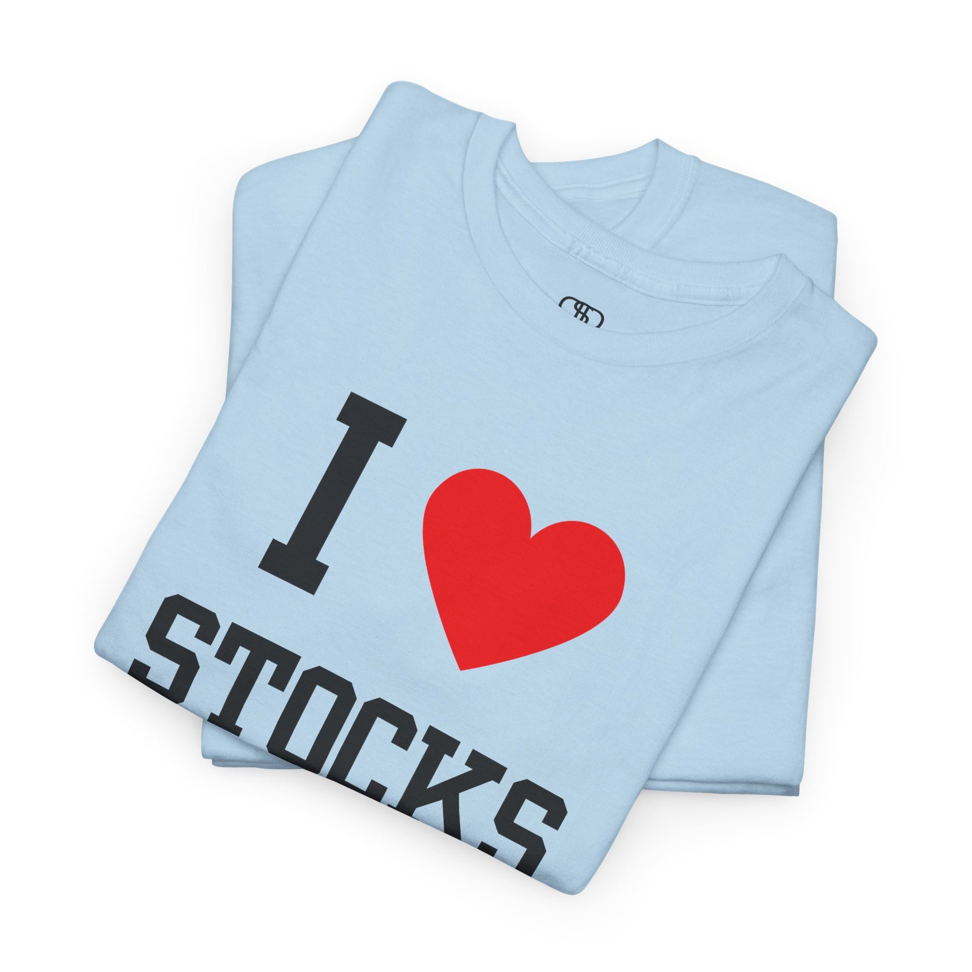 A light blue folded t-shirt  displaying the text "I," a red heart graphic symbolizing love, and the word "Stocks" in a classic, bold typeface.